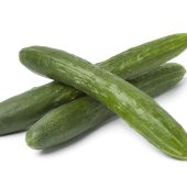 Fresh japanese cucumbers and slices on white background